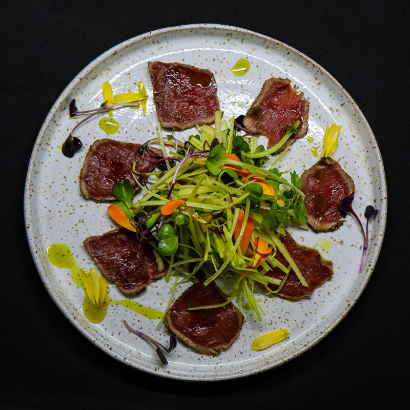 Cured venison tataki, with smoked apple and leek slaw